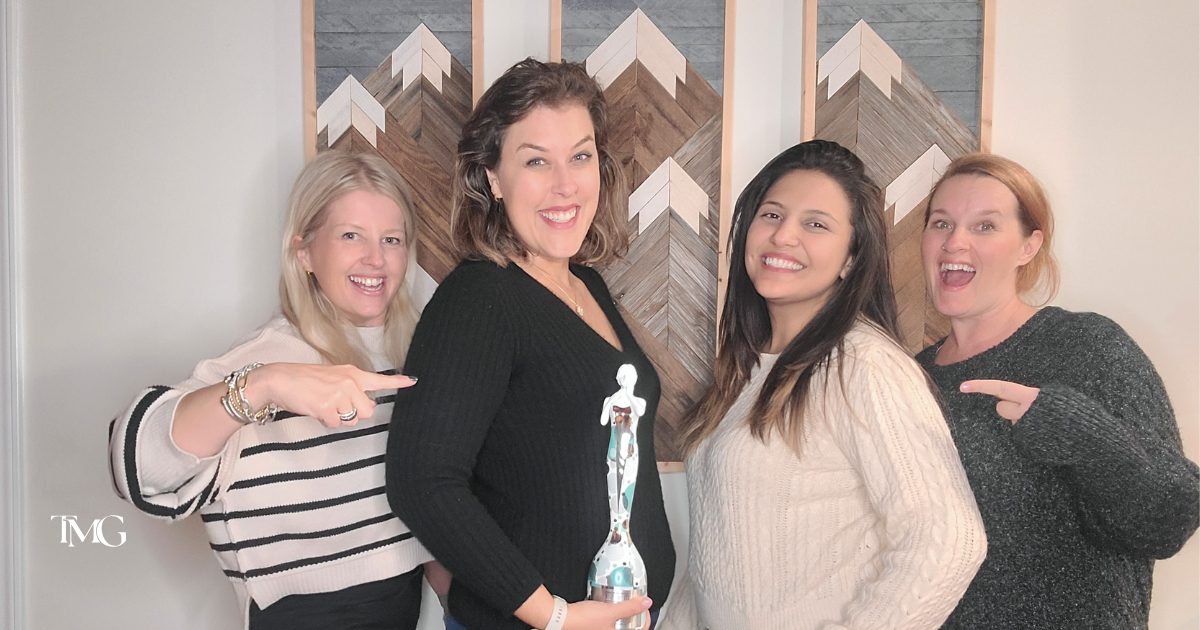 Muse Award Winners: Cristalle, Katelyn, Giselle, and Stefani holding the award.