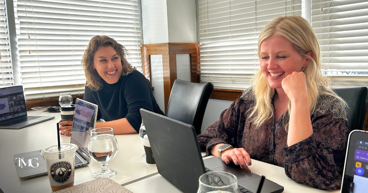 CEO and owner of The Molo Group, Katelyn Strumolo with Marketing Director Cristalle Gleason, reviewing SEO and Google Ads together in a meeting in Charlotte, NC.