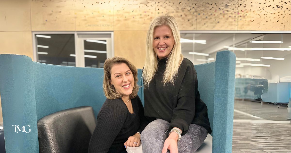Katelyn, former owner, and Cristalle, new owner of TMG, smiling together during a successful ownership transition marketing strategy rollout