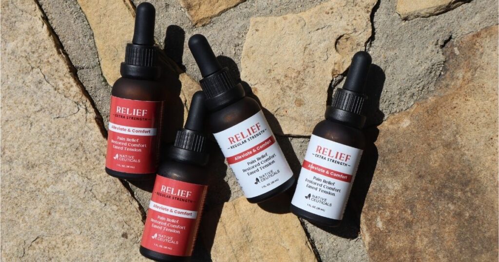 Native Ceuticals RELIEF tinctures displayed outdoors on natural stone, emphasizing updated packaging for pain relief and comfort.
