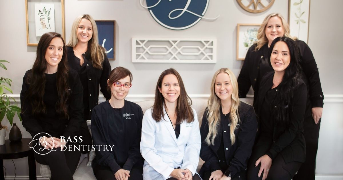 Friendly Bass Dentistry team in a warm, welcoming office setting emphasizing healthcare website design branding