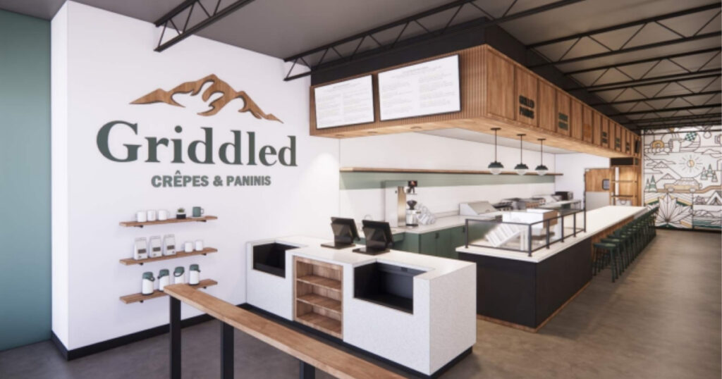 Interior architectural rendering (property of River Valley Architects) of Griddled highlighting the restaurant branding with a clean logo wall, natural wood finishes, and a functional service counter.