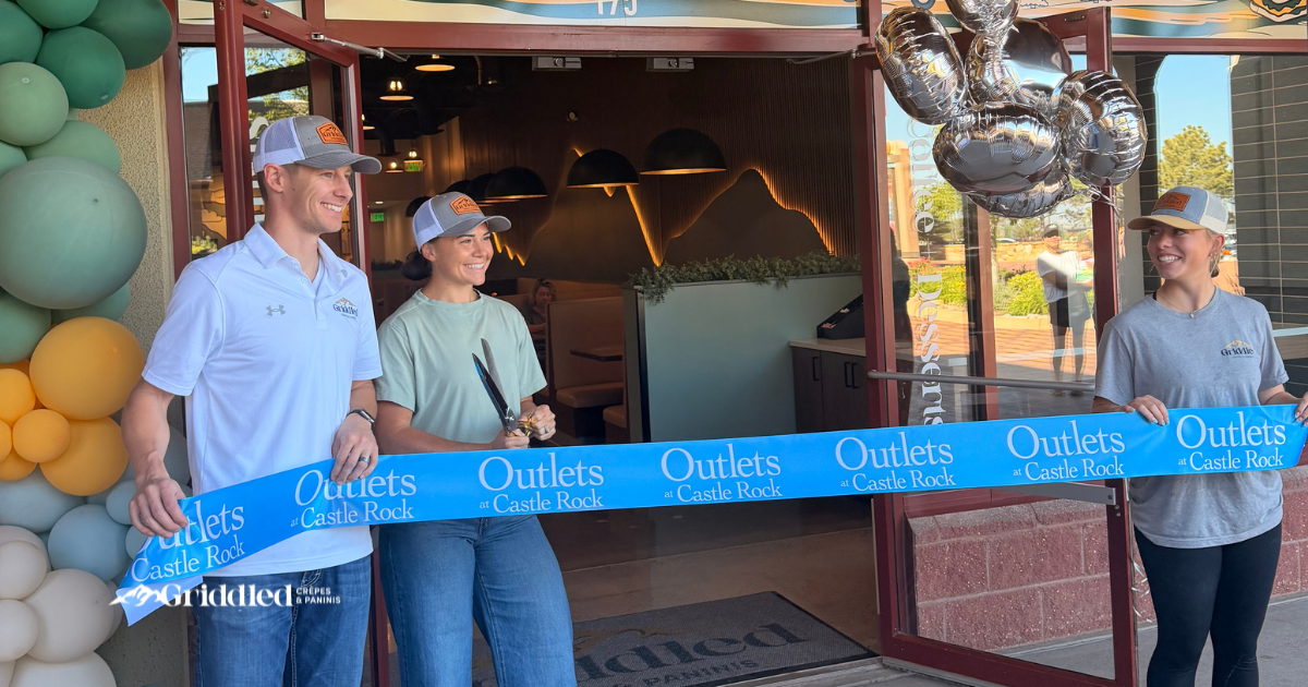 Griddled Crêpes & Paninis staff cut the ribbon at their Castle Rock storefront for their restaurant grand opening.